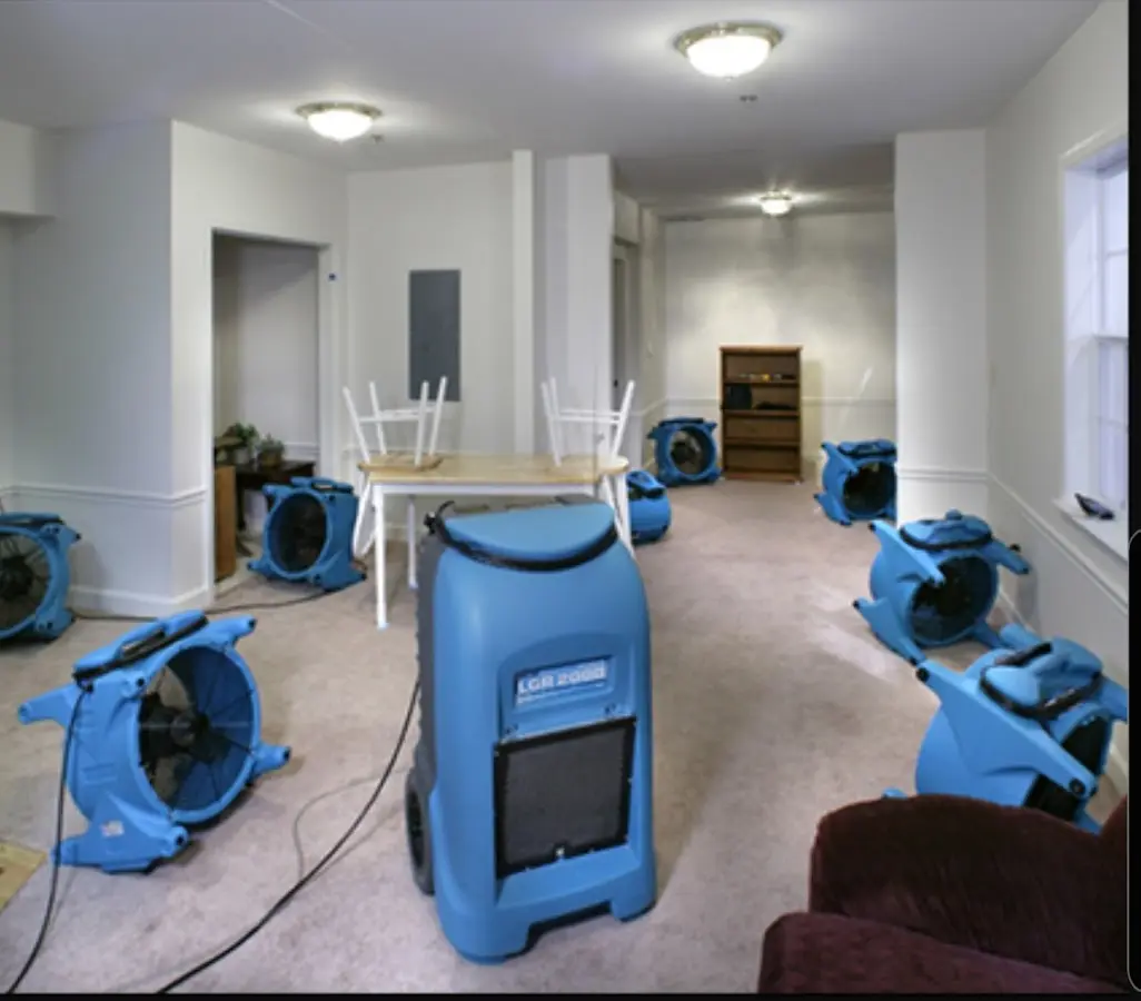 Air movers and dehumidifier setup for Water Extraction & Removal in The Village